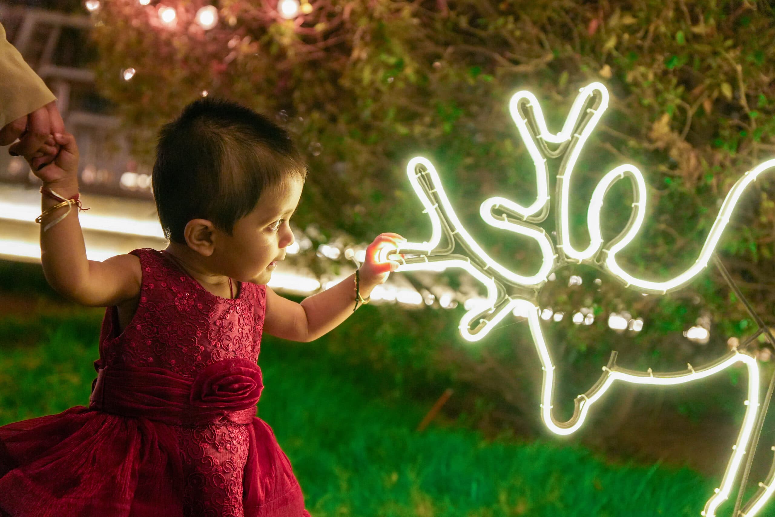 A child drawing with a sparkler in the dark